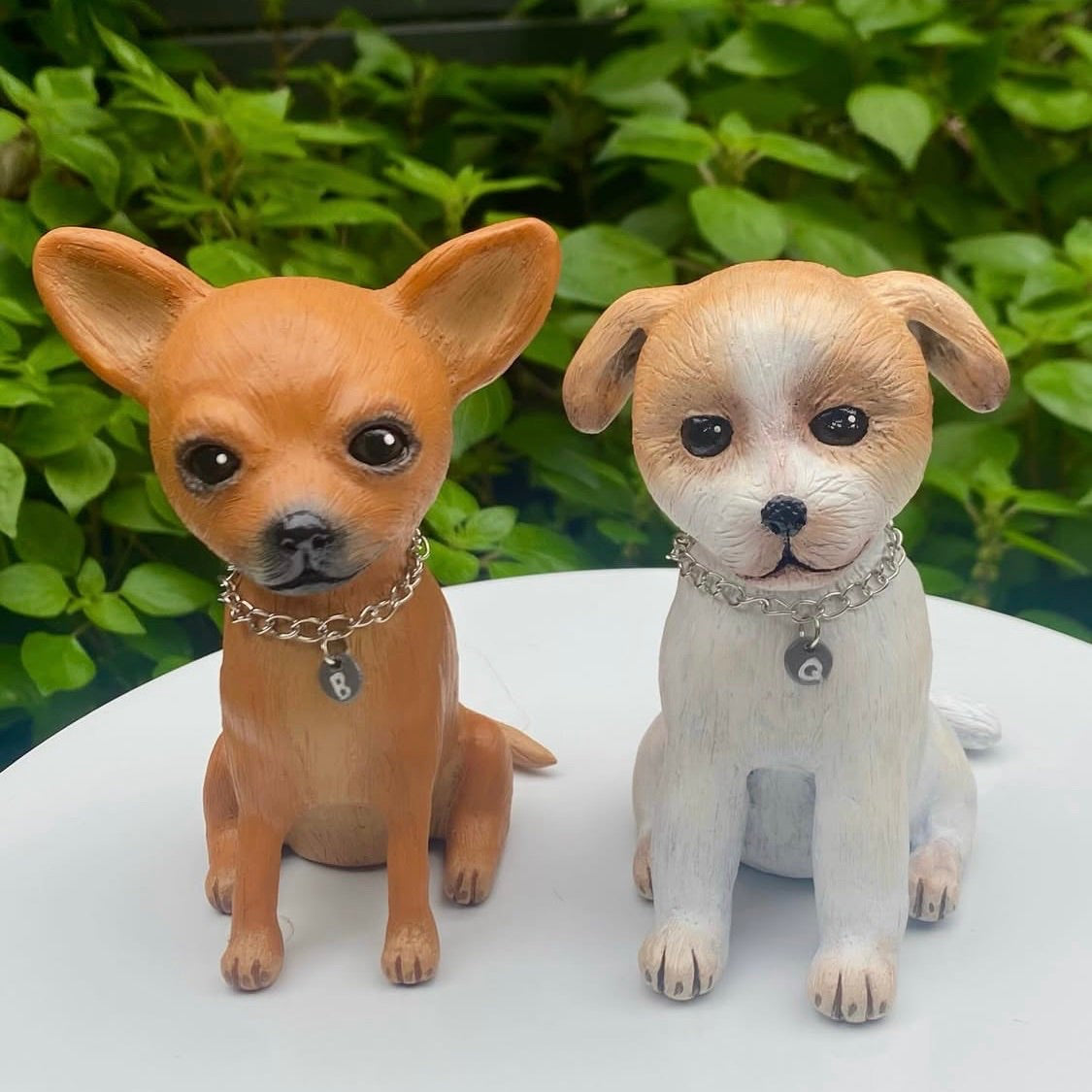 Two commissioned polymer clay sculptures of dogs, one Russian toy terrier the other a jack Russell.