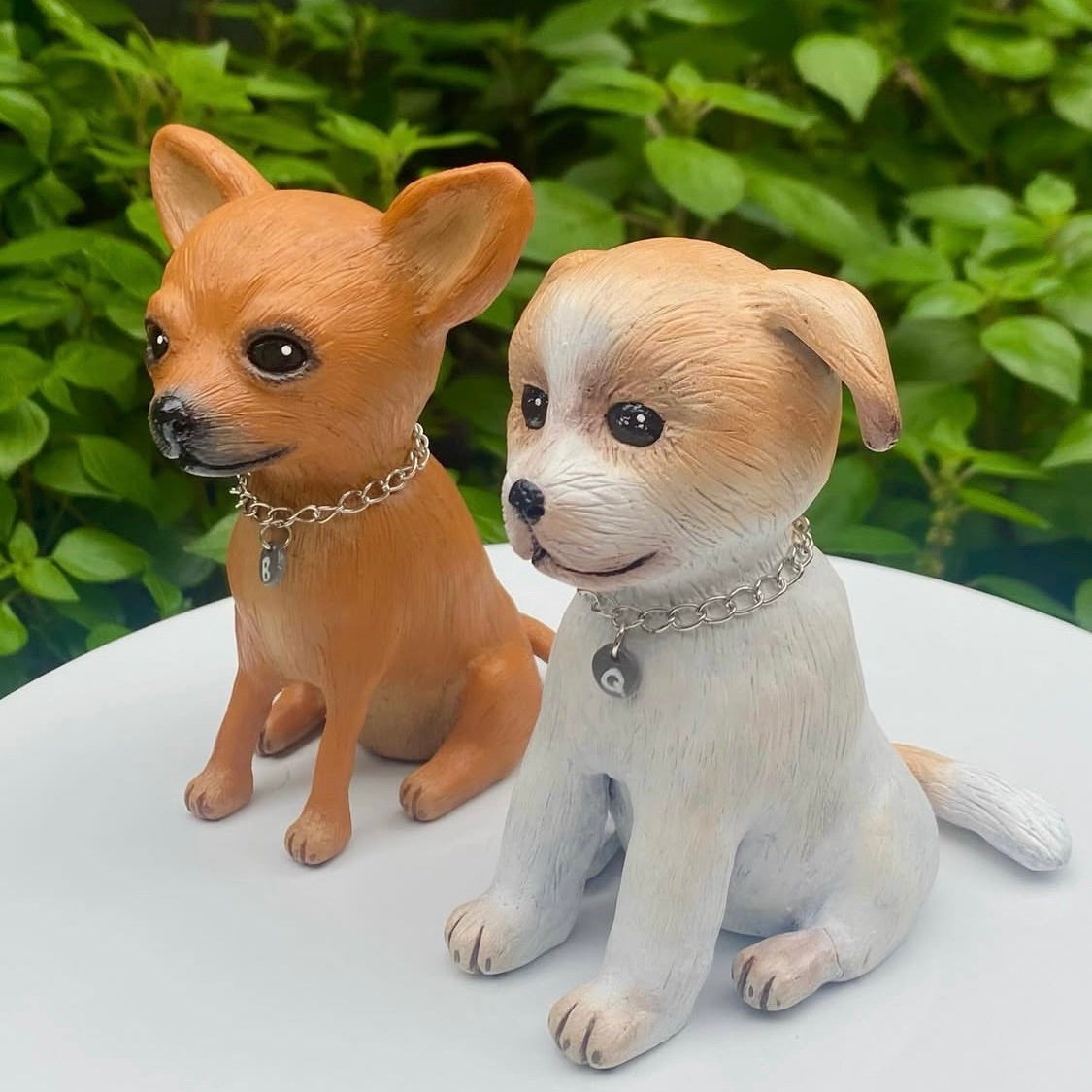 Two commissioned polymer clay sculptures of dogs, one Russian toy terrier the other a jack Russell.