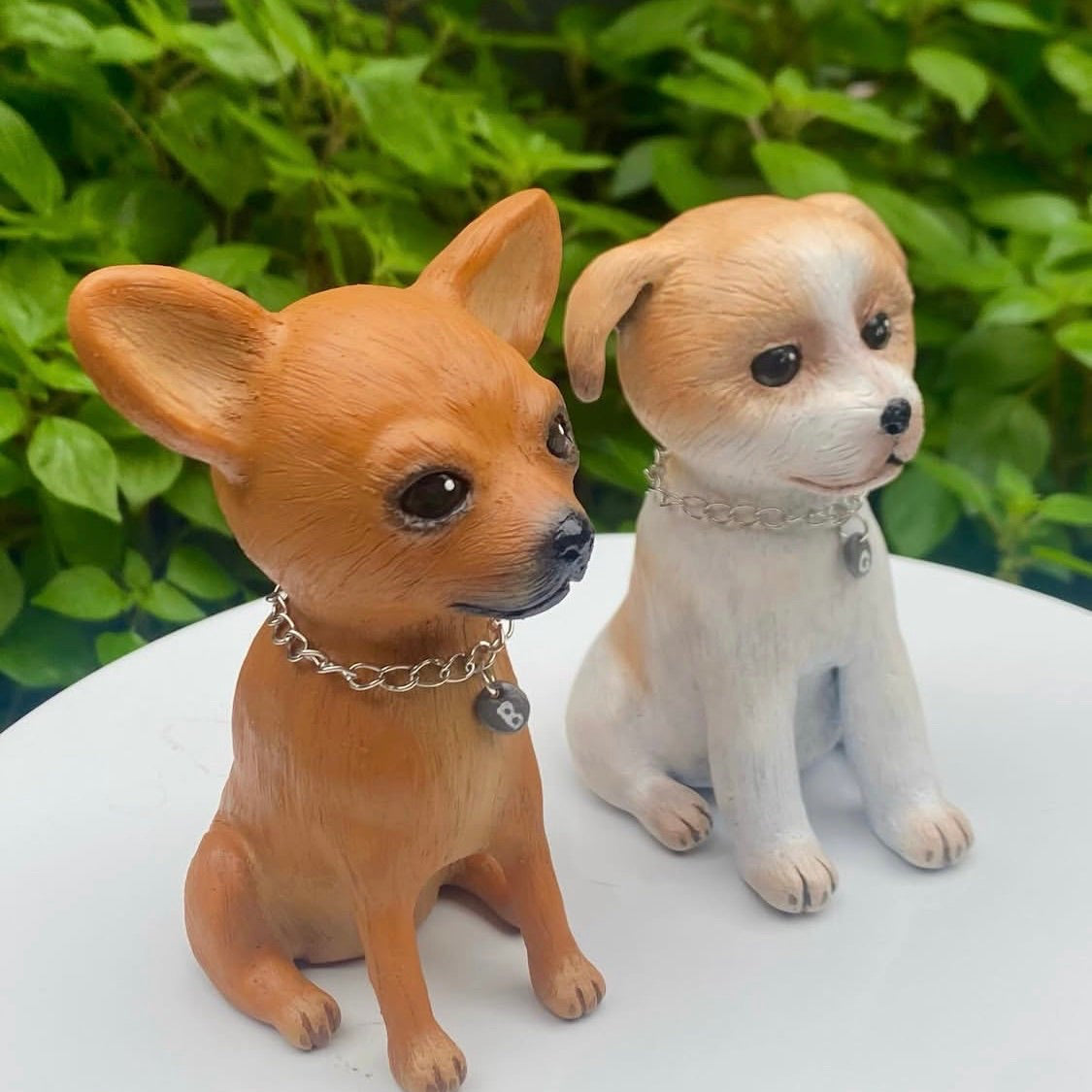 Two commissioned polymer clay sculptures of dogs, one Russian toy terrier the other a jack Russell.
