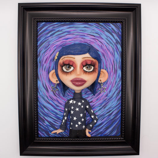 A polymer clay sculpture positioned in a black wood photo frame. Featuring Coraline in her iconic blue star sweater, set against an impressionistic view of the tunnel to the other world. 