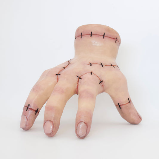Polymer clay sculpture of thing, the hand from Addams family. Featuring stitched skin and glossy nails with a hole in the wrist to store small items. 